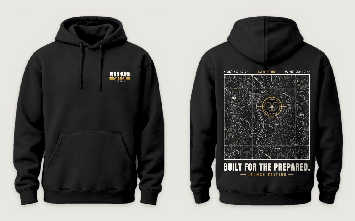 Topo Recon Hoodie in Black shown front and back: WARHORN TACTICAL / EST. 2026 lockup with gold bar, left chest; back: Full-back topographic map with grid coordinates and the full-color Warhorn ram reticle over “Built for the Prepared.” / Launch Edition